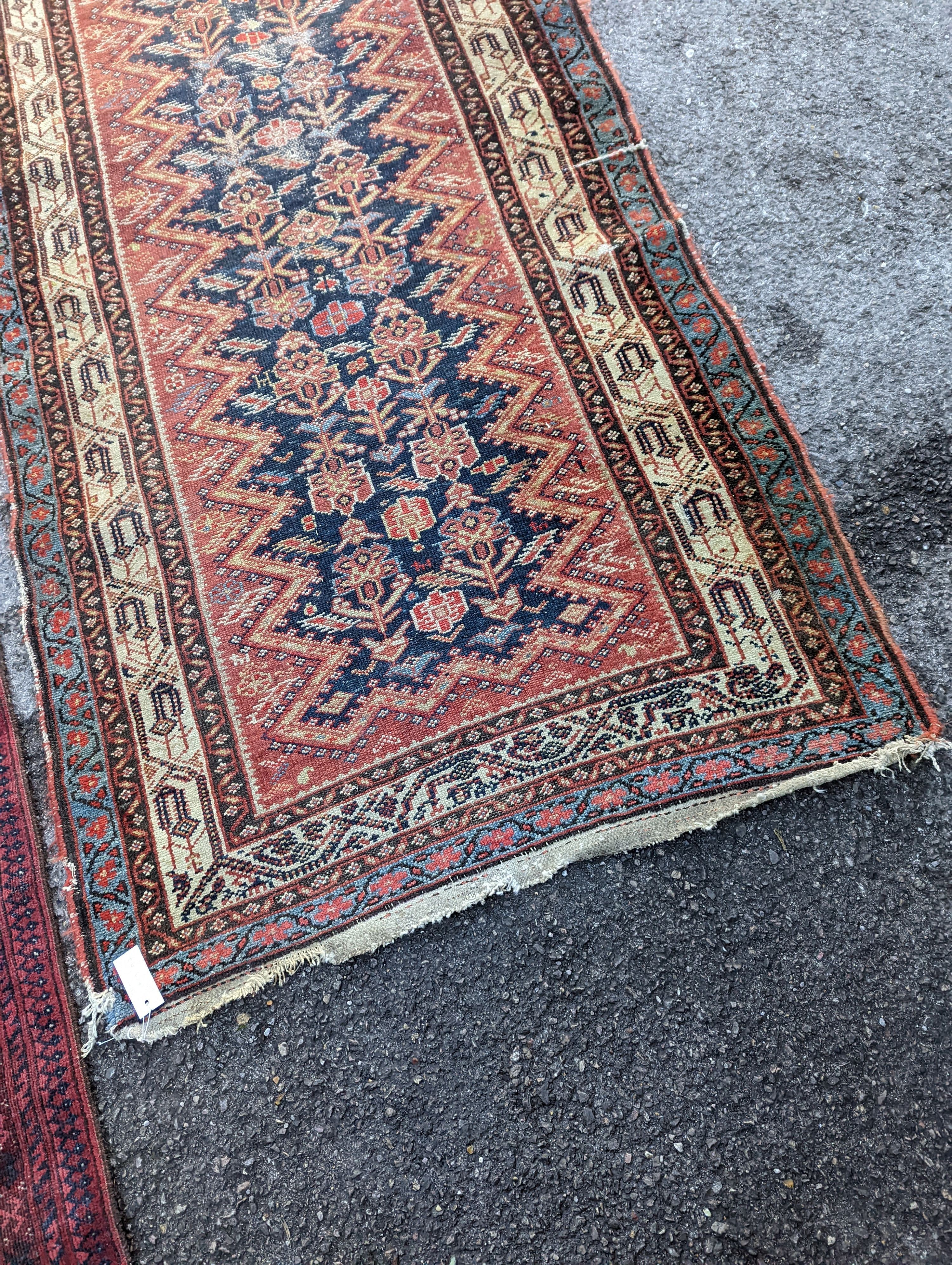 A Caucasian blue ground runner, 372 x 102cm